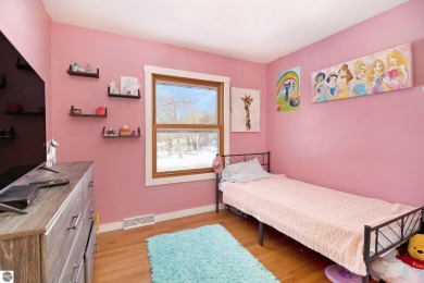 Discover comfort and convenience in this well-maintained on Bear Lake Highlands Golf Course in Michigan - for sale on GolfHomes.com, golf home, golf lot