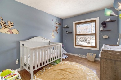 Discover comfort and convenience in this well-maintained on Bear Lake Highlands Golf Course in Michigan - for sale on GolfHomes.com, golf home, golf lot
