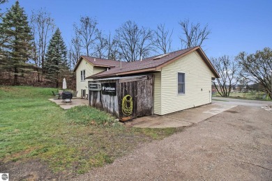 Discover comfort and convenience in this well-maintained on Bear Lake Highlands Golf Course in Michigan - for sale on GolfHomes.com, golf home, golf lot