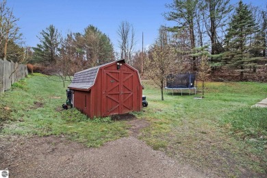 Discover comfort and convenience in this well-maintained on Bear Lake Highlands Golf Course in Michigan - for sale on GolfHomes.com, golf home, golf lot