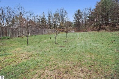 Discover comfort and convenience in this well-maintained on Bear Lake Highlands Golf Course in Michigan - for sale on GolfHomes.com, golf home, golf lot
