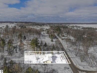 Discover comfort and convenience in this well-maintained on Bear Lake Highlands Golf Course in Michigan - for sale on GolfHomes.com, golf home, golf lot