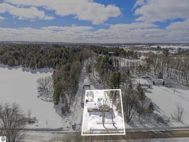 Discover comfort and convenience in this well-maintained on Bear Lake Highlands Golf Course in Michigan - for sale on GolfHomes.com, golf home, golf lot