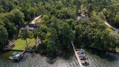 Lakefront Living at Its Finest - Nestled on a picturesque 1-acre on The Patriot Golf Club At Grand Harbor in South Carolina - for sale on GolfHomes.com, golf home, golf lot
