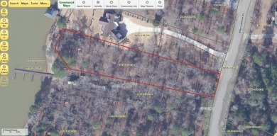 Lakefront Living at Its Finest - Nestled on a picturesque 1-acre on The Patriot Golf Club At Grand Harbor in South Carolina - for sale on GolfHomes.com, golf home, golf lot