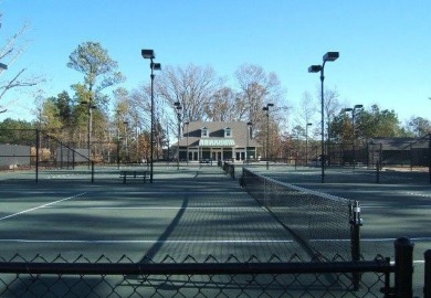Lakefront Living at Its Finest - Nestled on a picturesque 1-acre on The Patriot Golf Club At Grand Harbor in South Carolina - for sale on GolfHomes.com, golf home, golf lot