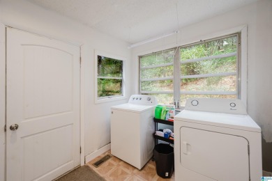 Welcome to Million Dollar Lakes. This 3-bedroom, 1.5-bath home on Lakeview Country Club in Alabama - for sale on GolfHomes.com, golf home, golf lot