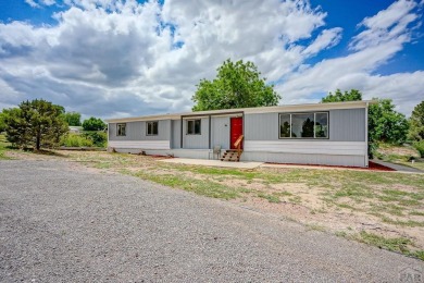 Charming three-bedroom, two-bath home in the heart of Colorado on Hollydot Golf Course in Colorado - for sale on GolfHomes.com, golf home, golf lot