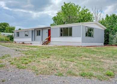 Charming three-bedroom, two-bath home in the heart of Colorado on Hollydot Golf Course in Colorado - for sale on GolfHomes.com, golf home, golf lot