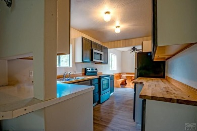 Charming three-bedroom, two-bath home in the heart of Colorado on Hollydot Golf Course in Colorado - for sale on GolfHomes.com, golf home, golf lot