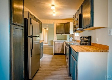Charming three-bedroom, two-bath home in the heart of Colorado on Hollydot Golf Course in Colorado - for sale on GolfHomes.com, golf home, golf lot
