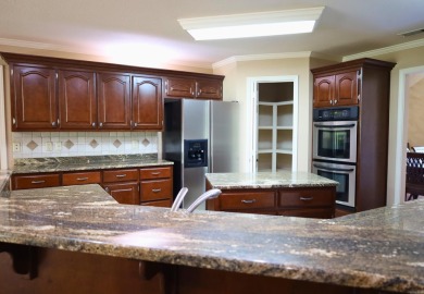 Experience the epitome of luxury in this stunning 4-bedroom, 2 on Paragould Country Club in Arkansas - for sale on GolfHomes.com, golf home, golf lot