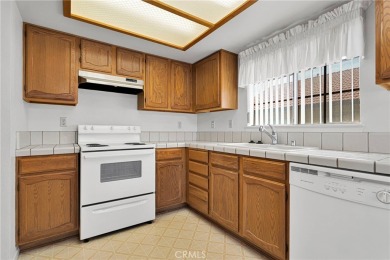 This charming home is in the highly sought-after gated community on Ashwood Golf Course in California - for sale on GolfHomes.com, golf home, golf lot