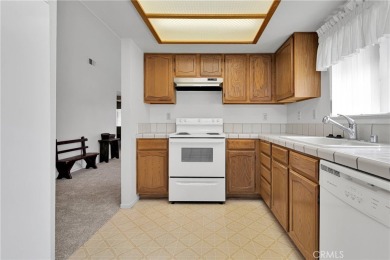 This charming home is in the highly sought-after gated community on Ashwood Golf Course in California - for sale on GolfHomes.com, golf home, golf lot