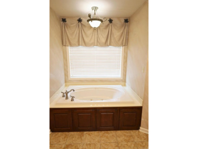 Experience the epitome of luxury in this stunning 4-bedroom, 2 on Paragould Country Club in Arkansas - for sale on GolfHomes.com, golf home, golf lot