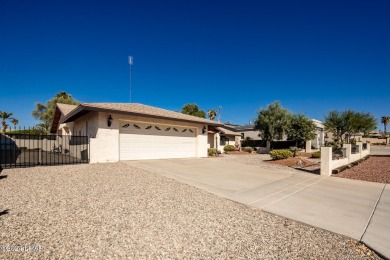 It is a quick golf cart trip down the street to the beautiful on London Bridge Golf Course in Arizona - for sale on GolfHomes.com, golf home, golf lot