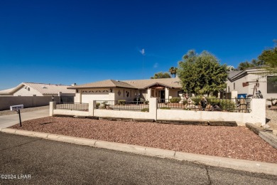 It is a quick golf cart trip down the street to the beautiful on London Bridge Golf Course in Arizona - for sale on GolfHomes.com, golf home, golf lot