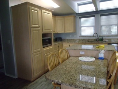 Stunning 3 Bedroom Palm Harbor Home -  Key Features:  Bedrooms: on Schalamar Creek Golf and Country Club in Florida - for sale on GolfHomes.com, golf home, golf lot