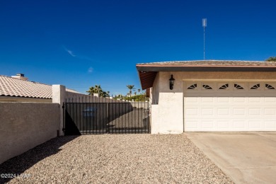 It is a quick golf cart trip down the street to the beautiful on London Bridge Golf Course in Arizona - for sale on GolfHomes.com, golf home, golf lot