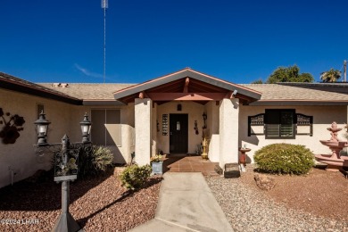 It is a quick golf cart trip down the street to the beautiful on London Bridge Golf Course in Arizona - for sale on GolfHomes.com, golf home, golf lot