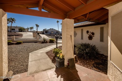 It is a quick golf cart trip down the street to the beautiful on London Bridge Golf Course in Arizona - for sale on GolfHomes.com, golf home, golf lot