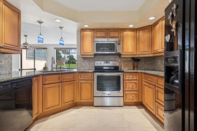 Beautifully furnished townhome located in the Windermere on PGA National Golf Club in Florida - for sale on GolfHomes.com, golf home, golf lot