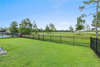 Modern 4-bedroom, 2-bathroom house positioned along the greens on The National Golf Club of Louisiana in Louisiana - for sale on GolfHomes.com, golf home, golf lot