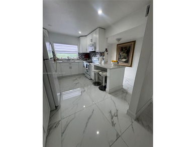 A beautifully remodeled two-bedroom, two-bathroom apartment on Sunrise Lakes Phase IV Golf Course in Florida - for sale on GolfHomes.com, golf home, golf lot