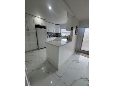 A beautifully remodeled two-bedroom, two-bathroom apartment on Sunrise Lakes Phase IV Golf Course in Florida - for sale on GolfHomes.com, golf home, golf lot