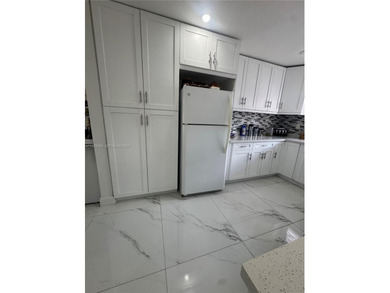 A beautifully remodeled two-bedroom, two-bathroom apartment on Sunrise Lakes Phase IV Golf Course in Florida - for sale on GolfHomes.com, golf home, golf lot