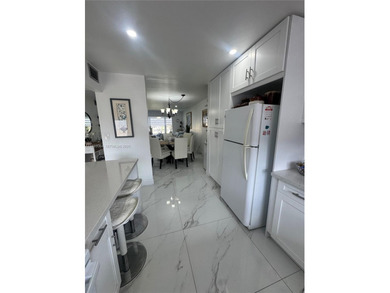 A beautifully remodeled two-bedroom, two-bathroom apartment on Sunrise Lakes Phase IV Golf Course in Florida - for sale on GolfHomes.com, golf home, golf lot