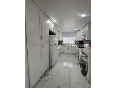 A beautifully remodeled two-bedroom, two-bathroom apartment on Sunrise Lakes Phase IV Golf Course in Florida - for sale on GolfHomes.com, golf home, golf lot