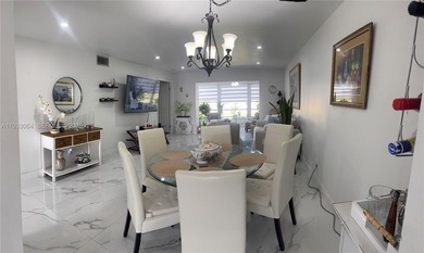 A beautifully remodeled two-bedroom, two-bathroom apartment on Sunrise Lakes Phase IV Golf Course in Florida - for sale on GolfHomes.com, golf home, golf lot