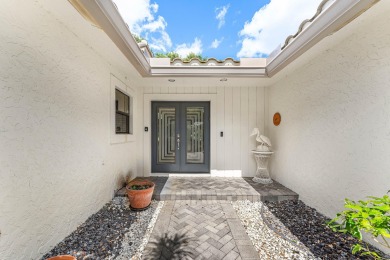 Photos feature remodel concept renderings.Set on a quiet on  in Florida - for sale on GolfHomes.com, golf home, golf lot