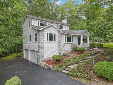 Located in the amenity-filled golf course community Country Club on Country Club of the Poconos Golf Course in Pennsylvania - for sale on GolfHomes.com, golf home, golf lot