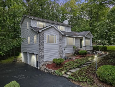 Located in the amenity-filled golf course community Country Club on Country Club of the Poconos Golf Course in Pennsylvania - for sale on GolfHomes.com, golf home, golf lot