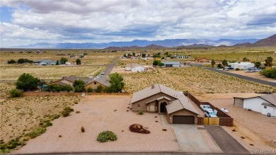 CLEAN HOME WITH STUNNING VIEWS, AND SITTING ON ( .40 ) OF AN on Valle Vista Golf Course in Arizona - for sale on GolfHomes.com, golf home, golf lot