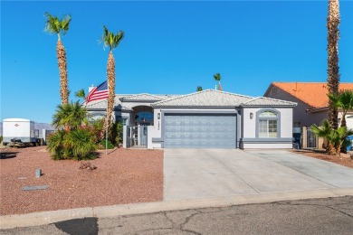 Live like you are on vacation every day in this resort-like on Desert Lakes Golf Course in Arizona - for sale on GolfHomes.com, golf home, golf lot