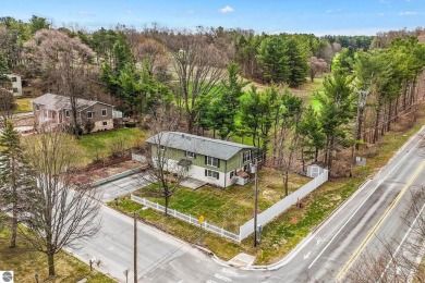 Located just within the city limits, this home offers character on Traverse City Golf and Country Club in Michigan - for sale on GolfHomes.com, golf home, golf lot