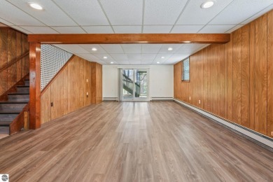 Located just within the city limits, this home offers character on Traverse City Golf and Country Club in Michigan - for sale on GolfHomes.com, golf home, golf lot