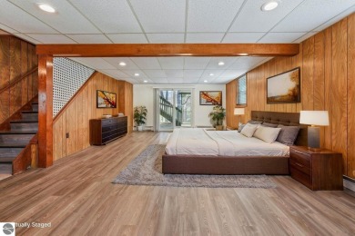 Located just within the city limits, this home offers character on Traverse City Golf and Country Club in Michigan - for sale on GolfHomes.com, golf home, golf lot