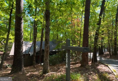 This is a light and bright, fully renovated, real log cabin in on Big Canoe Golf Club - Cherokee in Georgia - for sale on GolfHomes.com, golf home, golf lot