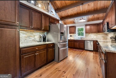 This is a light and bright, fully renovated, real log cabin in on Big Canoe Golf Club - Cherokee in Georgia - for sale on GolfHomes.com, golf home, golf lot