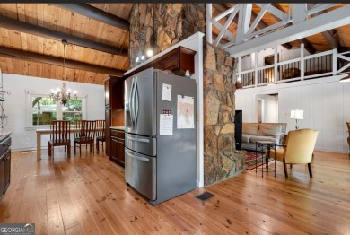 This is a light and bright, fully renovated, real log cabin in on Big Canoe Golf Club - Cherokee in Georgia - for sale on GolfHomes.com, golf home, golf lot