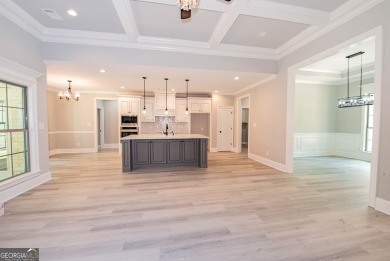 Nestled on 2.22 acres, this exquisite new construction two-story on Perry Country Club in Georgia - for sale on GolfHomes.com, golf home, golf lot