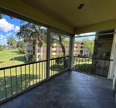Welcome to your serene sanctuary in the gated community of on Inverrary Country Club in Florida - for sale on GolfHomes.com, golf home, golf lot