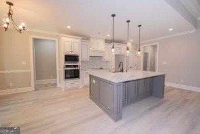 Nestled on 2.22 acres, this exquisite new construction two-story on Perry Country Club in Georgia - for sale on GolfHomes.com, golf home, golf lot