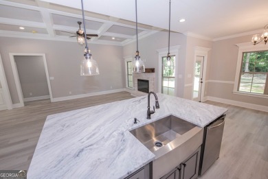 Nestled on 2.22 acres, this exquisite new construction two-story on Perry Country Club in Georgia - for sale on GolfHomes.com, golf home, golf lot