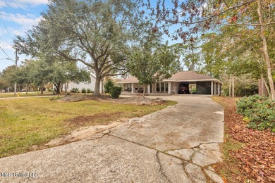 Welcome to this charming brick home located right on the Timber on Pass Christian Isles Golf Club in Mississippi - for sale on GolfHomes.com, golf home, golf lot