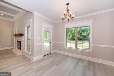 Nestled on 2.22 acres, this exquisite new construction two-story on Perry Country Club in Georgia - for sale on GolfHomes.com, golf home, golf lot